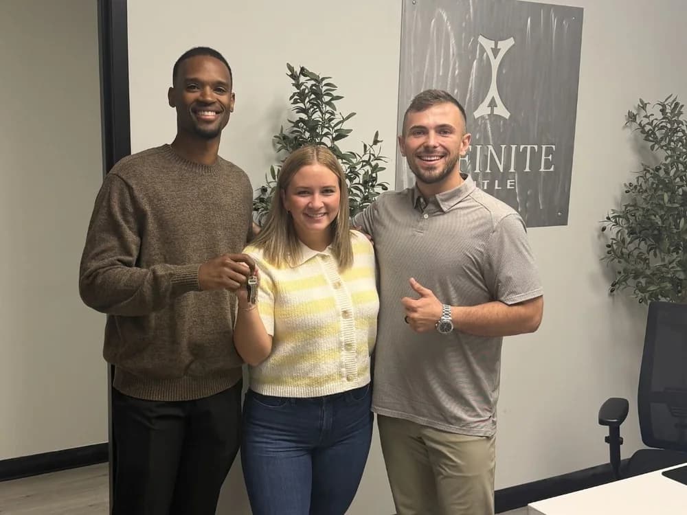 Homebuyer client with keys at closing